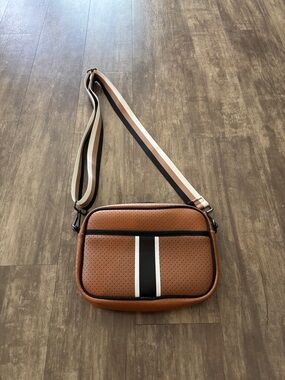 HAUTE SHORE Brown Perforated Crossbody with Black & White Center Stripe